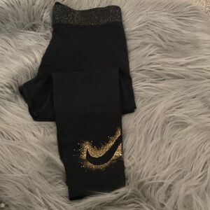 Nike Women’s Black Leggings with Gold Accents